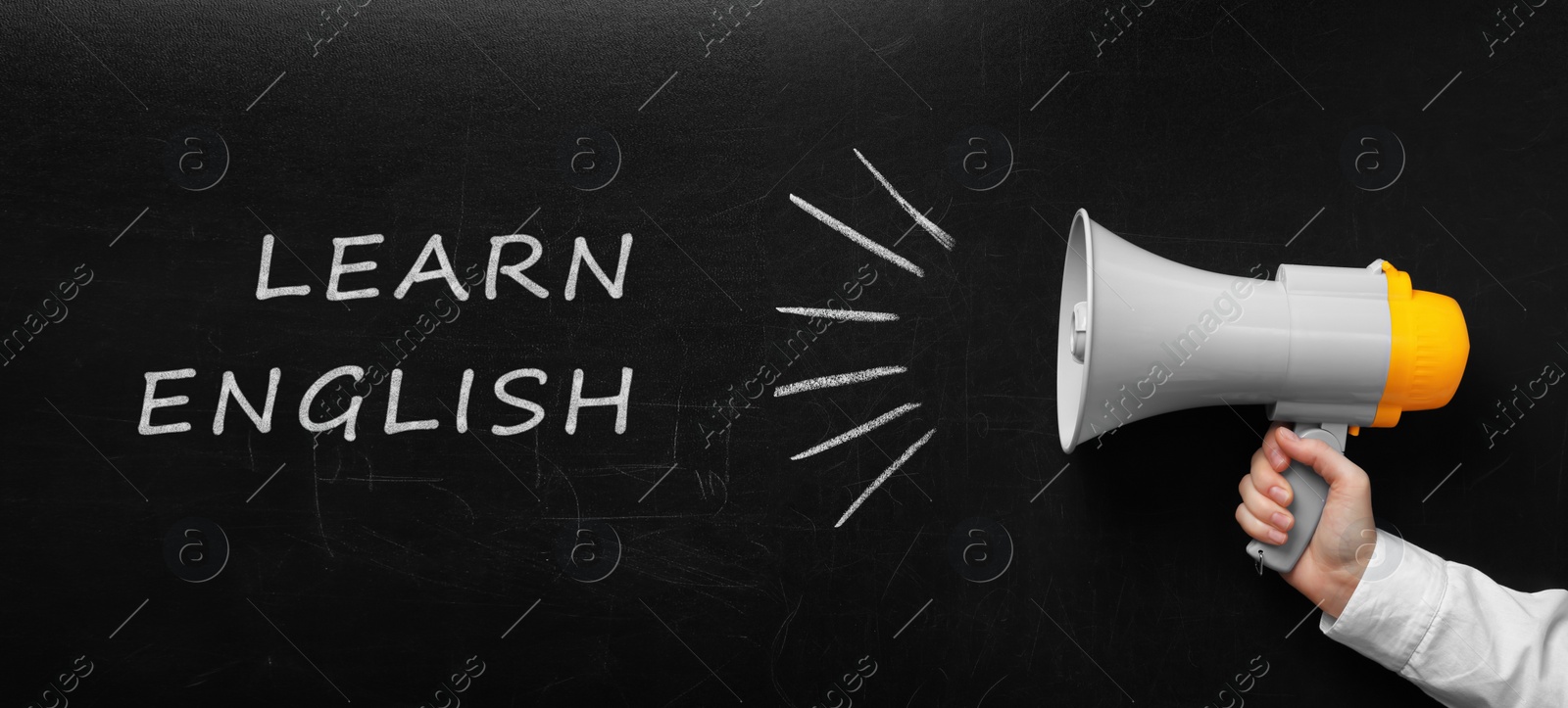 Image of Man holding megaphone near blackboard with text Learn English, closeup. Banner design