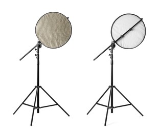 Tripods with reflectors on white background. Professional photographer's equipment