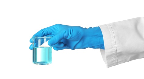 Photo of Scientist holding glass beaker with liquid on white background. Chemical research