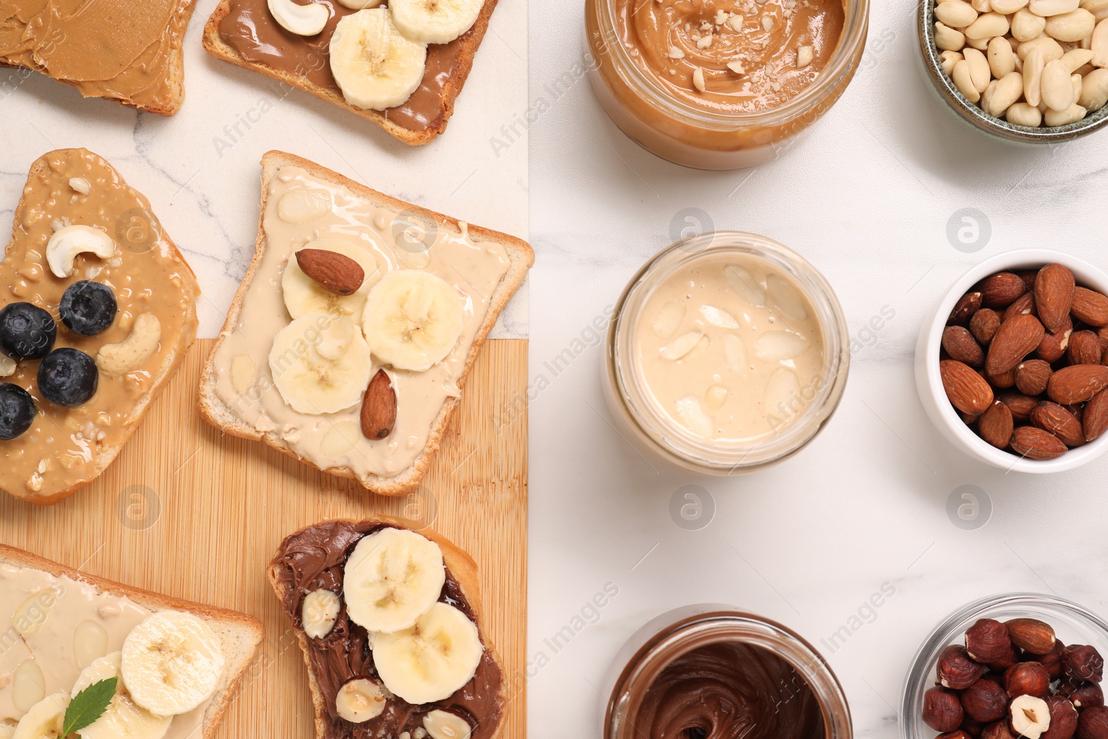 Photo of Toasts with different nut butters and products on white marble table, flat lay