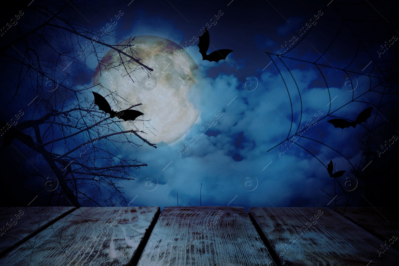 Image of Wooden surface and bats flying in night sky with full moon. Halloween illustration