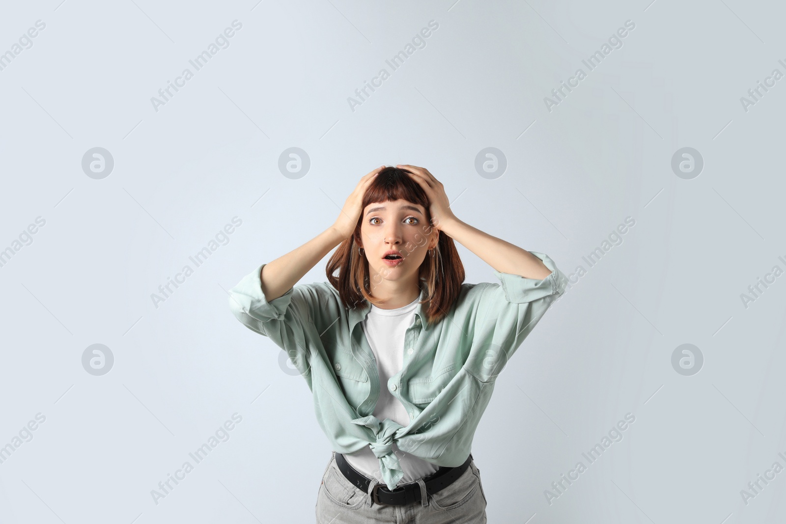 Photo of Portrait of emotional girl on white background