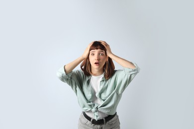 Portrait of emotional girl on white background