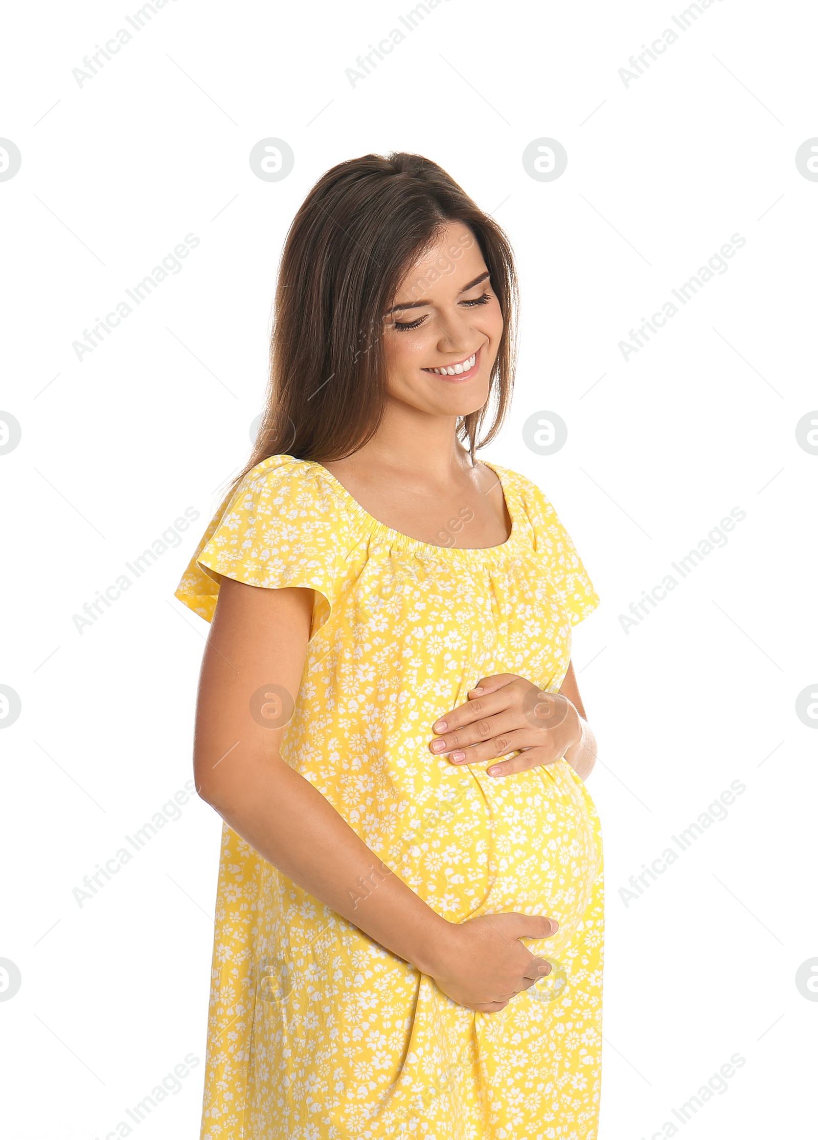 Photo of Happy pregnant woman touching her belly on white background