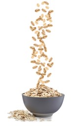 Image of Dry uncooked oatmeal falling into bowl on white background