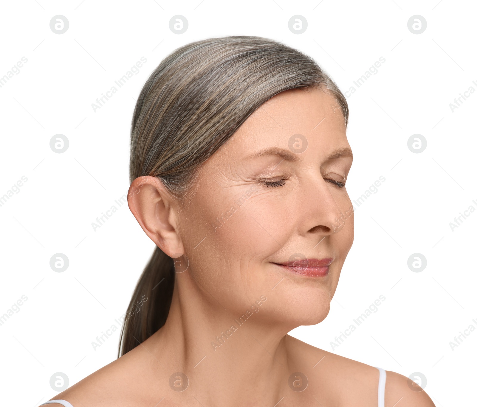 Photo of Portrait of senior woman with aging skin on white background. Rejuvenation treatment