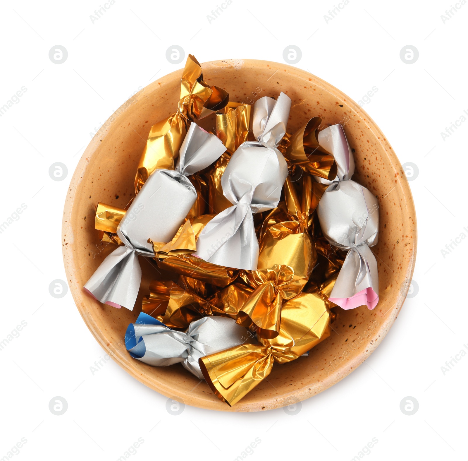 Photo of Bowl with candies in golden and silver wrappers isolated on white, top view