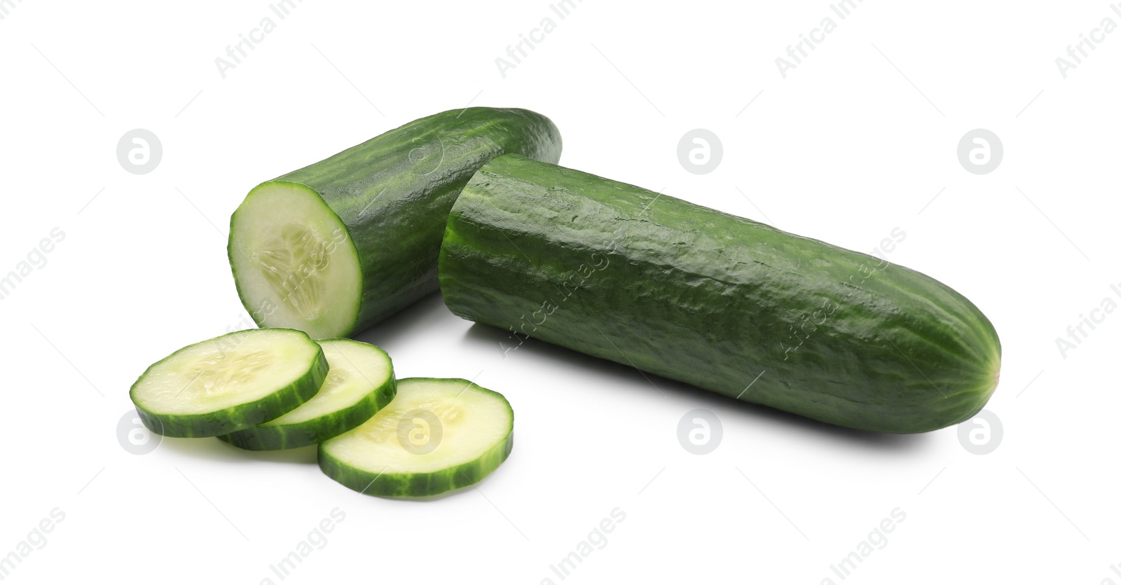 Photo of Halves and slices of long cucumber isolated on white