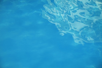 Photo of Surface of clean blue water in swimming pool, closeup