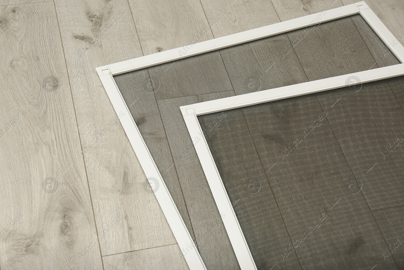 Photo of New insect screens for windows on wooden floor