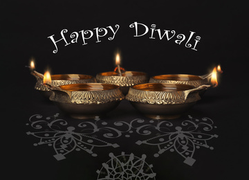 Image of Inscription Happy Diwali and clay lamps on dark background