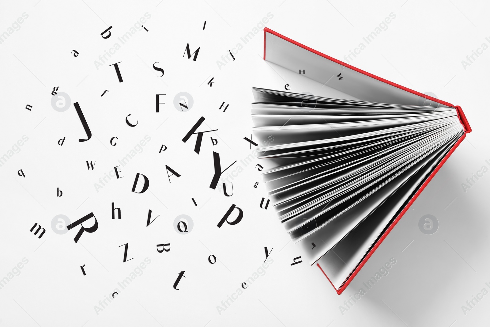 Image of Open book with many letters on light background, top view