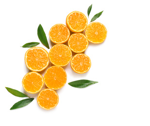 Photo of Composition with halves of fresh ripe tangerines and leaves on white background, top view. Citrus fruit