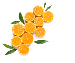 Composition with halves of fresh ripe tangerines and leaves on white background, top view. Citrus fruit