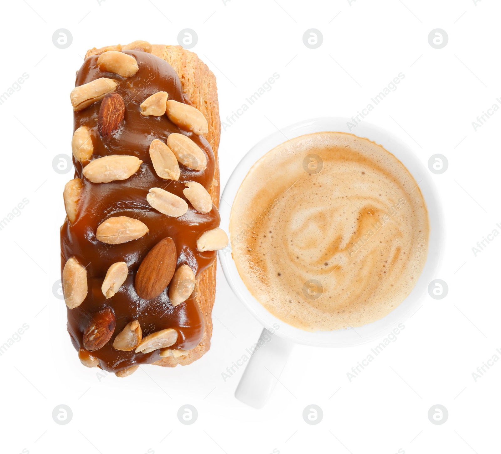 Photo of Round croissant with chocolate paste, nuts and cup of coffee isolated on white, top view. Tasty puff pastry