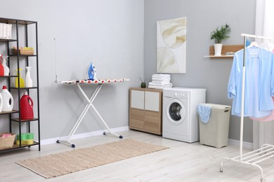 Laundry room interior with washing machine and furniture