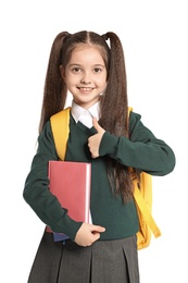 Photo of Little girl in stylish school uniform on white background