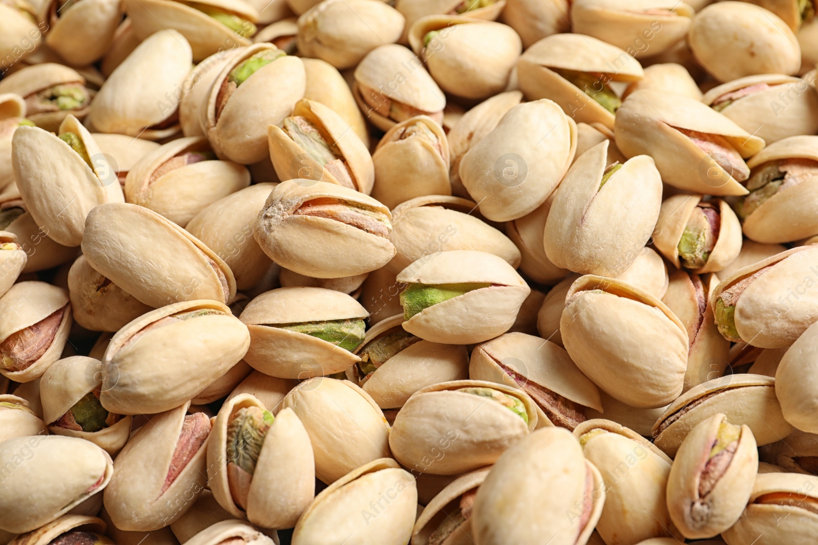Photo of Organic pistachio nuts in shell as background