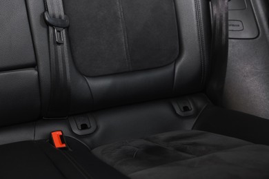 Clean leather seat inside of modern black car