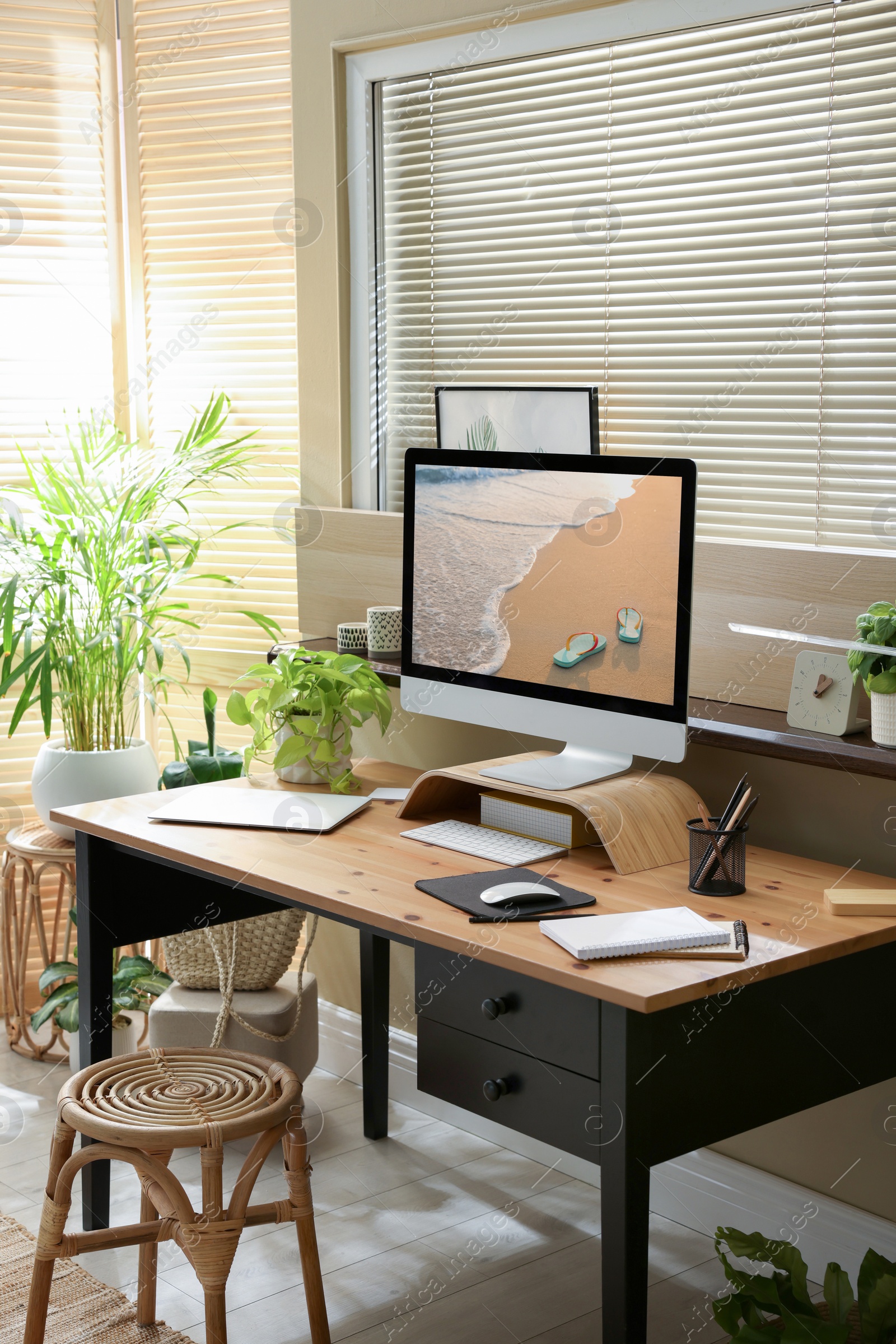 Photo of Light room interior with comfortable workplace near window