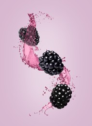 Image of Fresh blackberries and juice in air on violet background