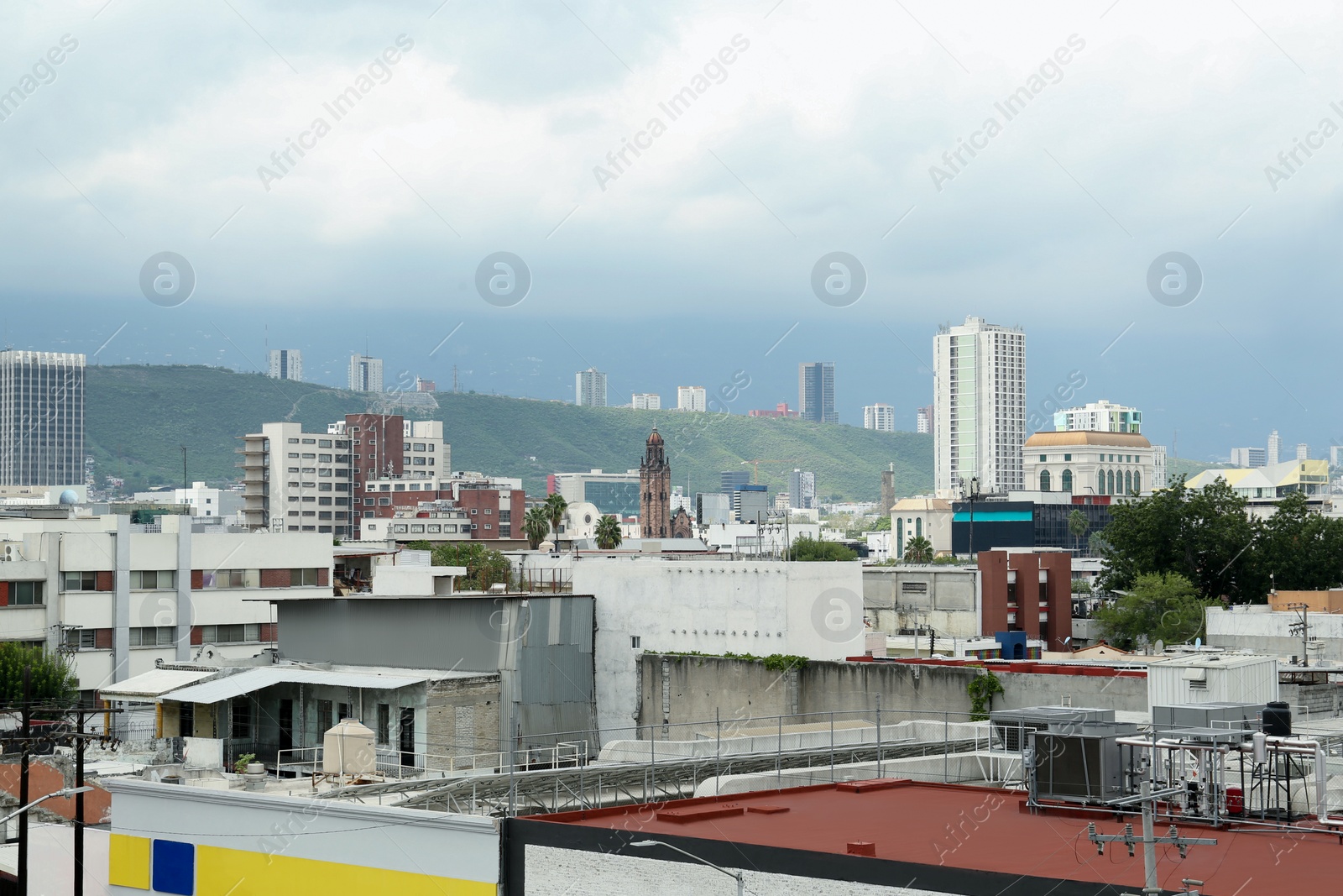 Photo of Beautiful view of different buildings in city and mountains