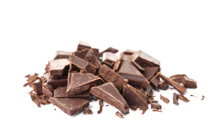 Photo of Delicious black chocolate pieces on white background