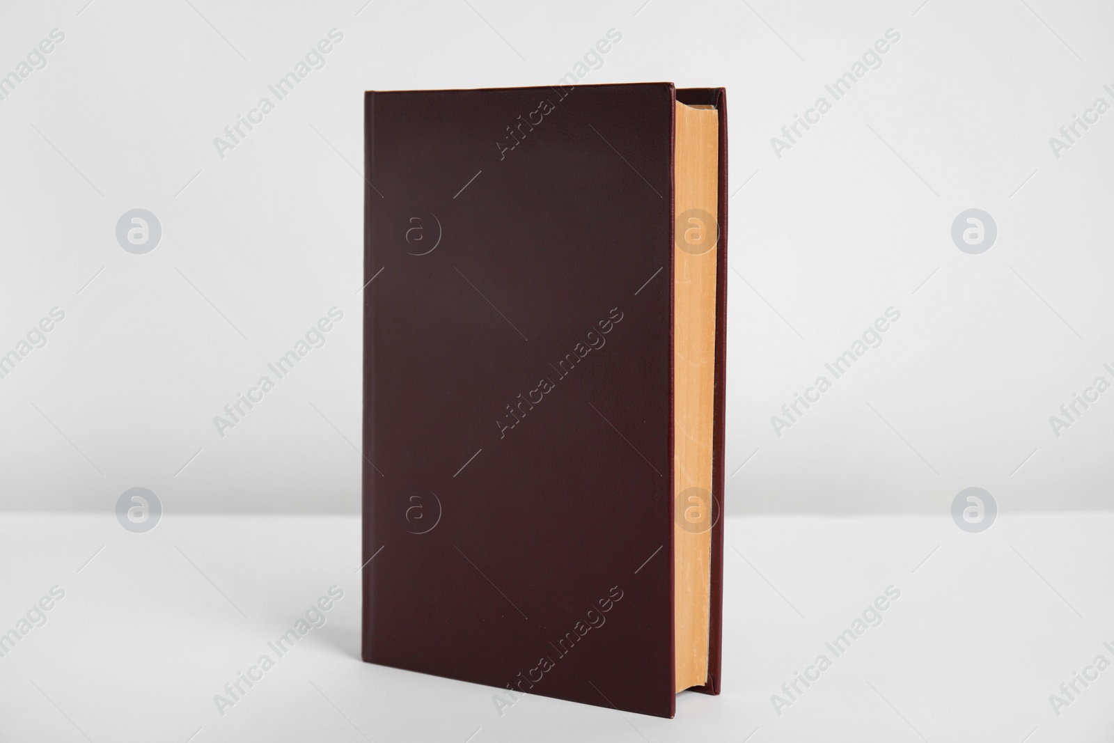 Photo of Blank book with hardcover on white background