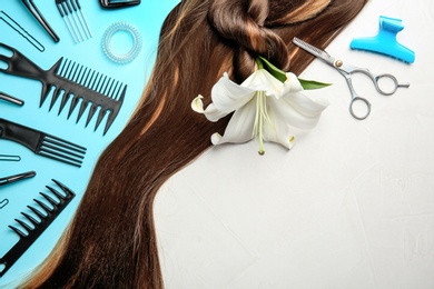 Photo of Flat lay composition with hair salon tools and space for text on gray background