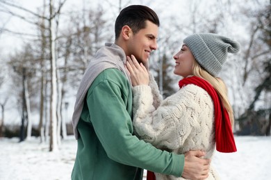 Beautiful happy couple outdoors on winter day