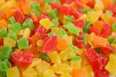 Photo of Mix of delicious candied fruits as background, closeup