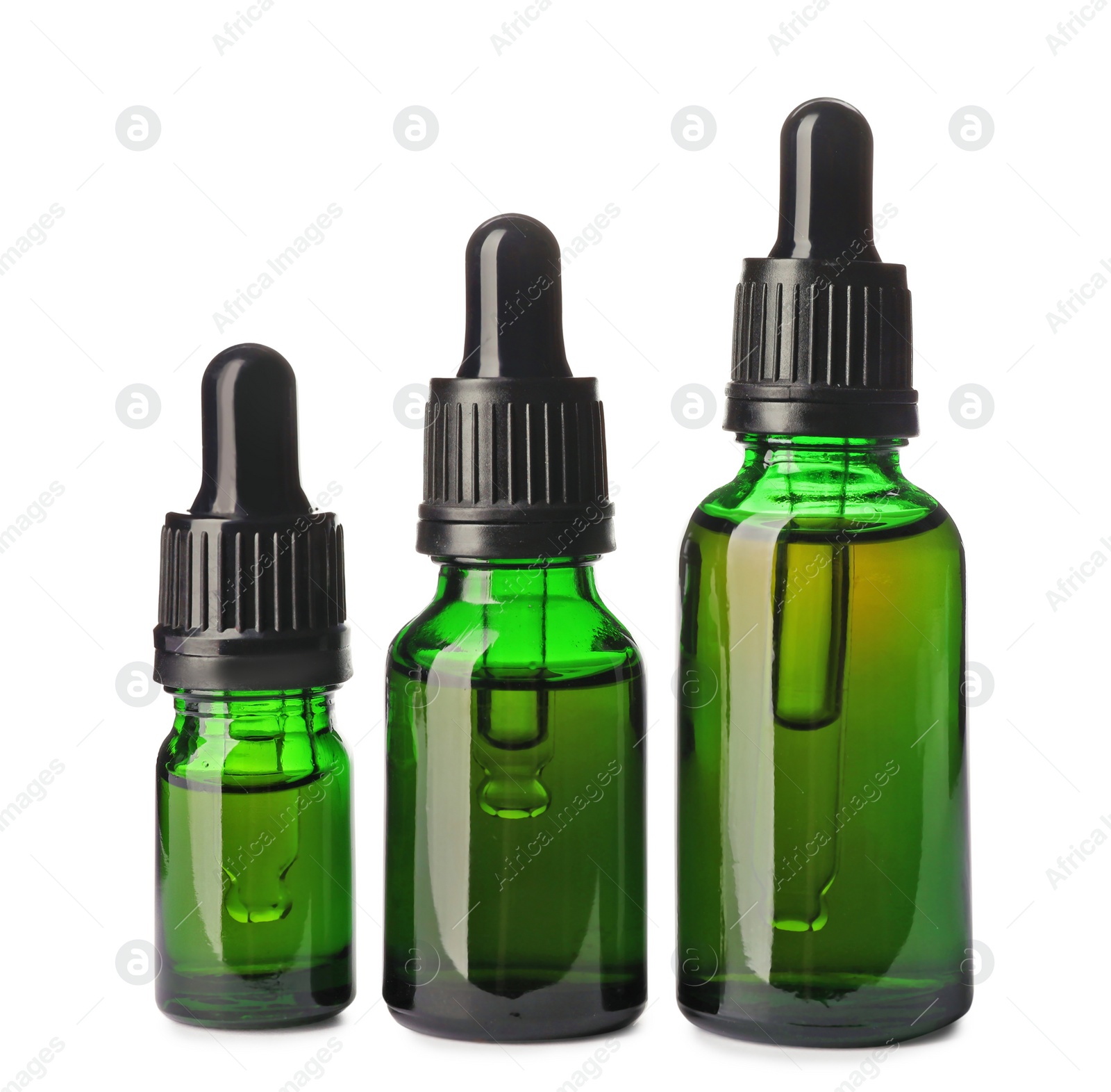 Photo of Cosmetic bottles of essential oils on white background