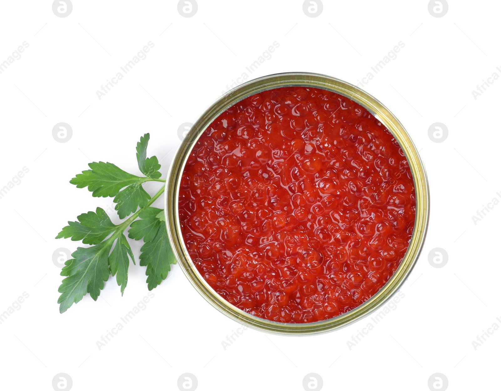 Photo of Open tin can of delicious red caviar and parsley on white background, top view