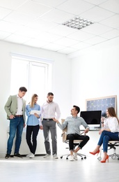 Photo of Young people having business training in office