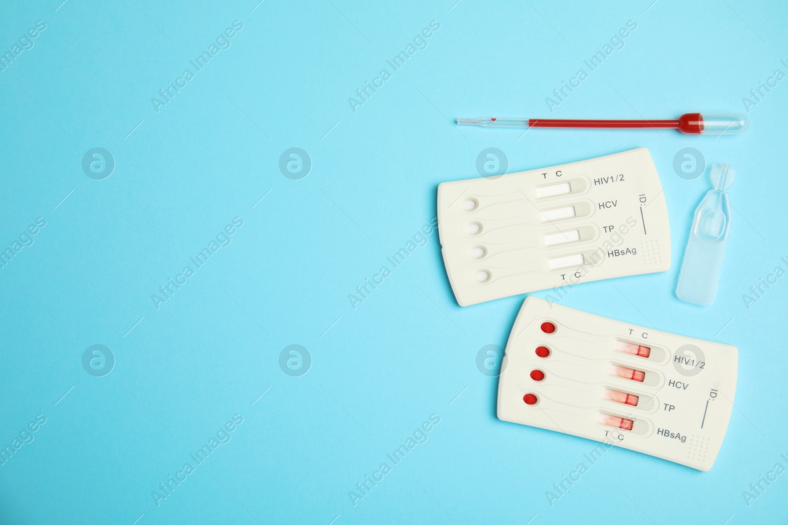 Photo of Disposable express hepatitis test kit on light blue background, flat lay. Space for text