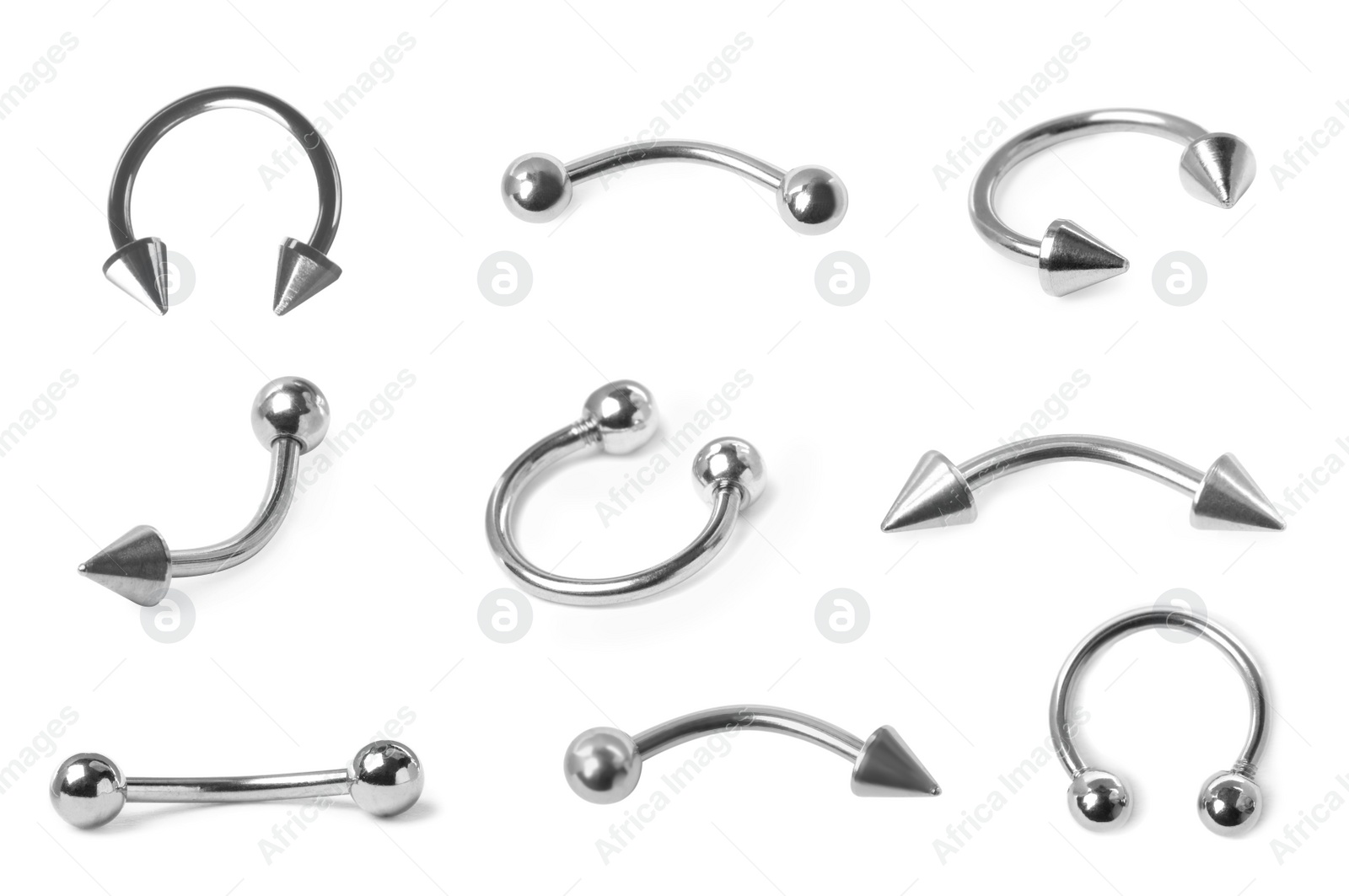 Image of Set with different piercing jewelry on white background