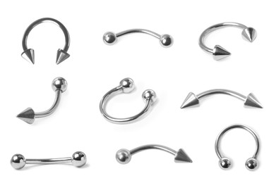 Image of Set with different piercing jewelry on white background