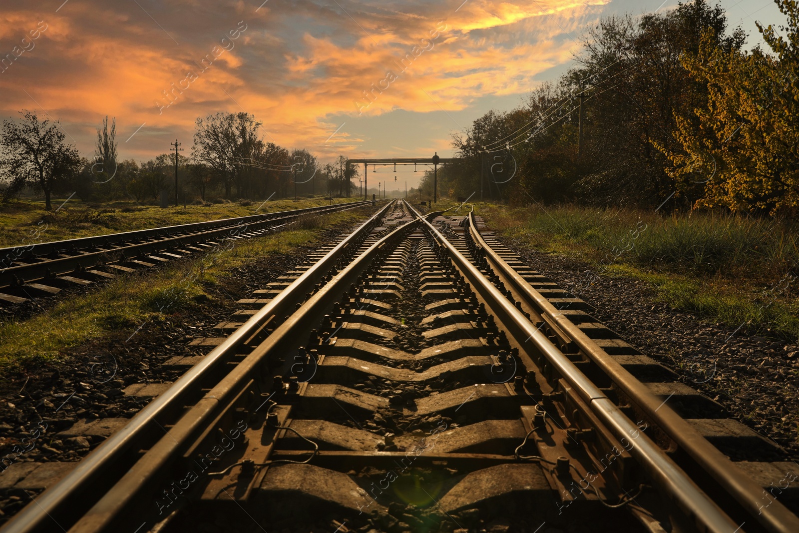 Photo of Railway lines in countryside on sunny day. Train journey