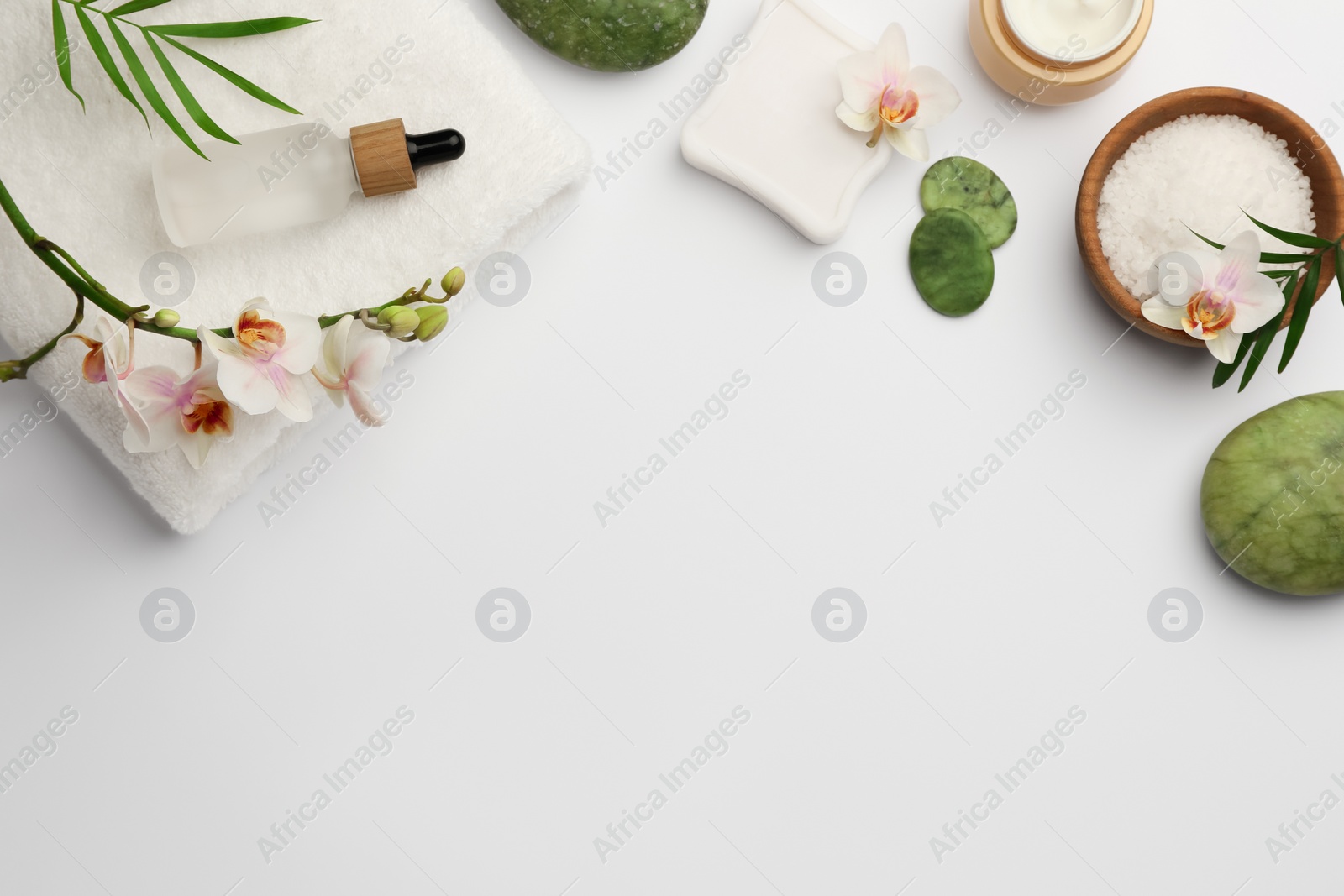 Photo of Flat lay composition with different spa products on white background. Space for text