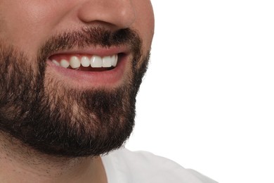 Photo of Happy young man with healthy teeth on white background, closeup