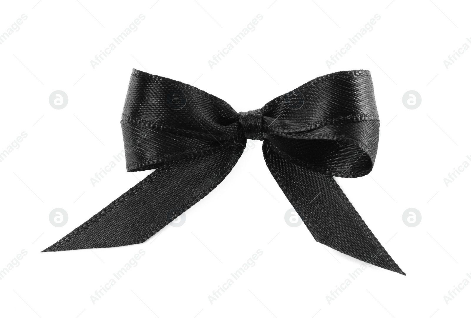 Photo of Elegant black ribbon tied in bow isolated on white, top view