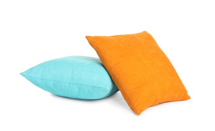 Different colorful decorative pillows on white background