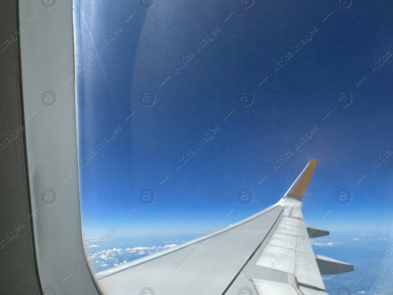 Photo of Beautiful view through plane window during flight. Air travel