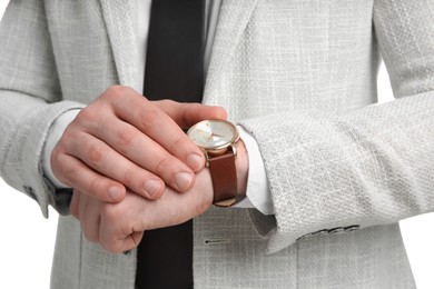 Photo of Businessman wearing wristwatch, closeup view. Time management