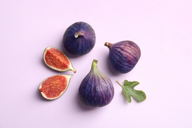 Photo of Fresh ripe figs on light background, top view