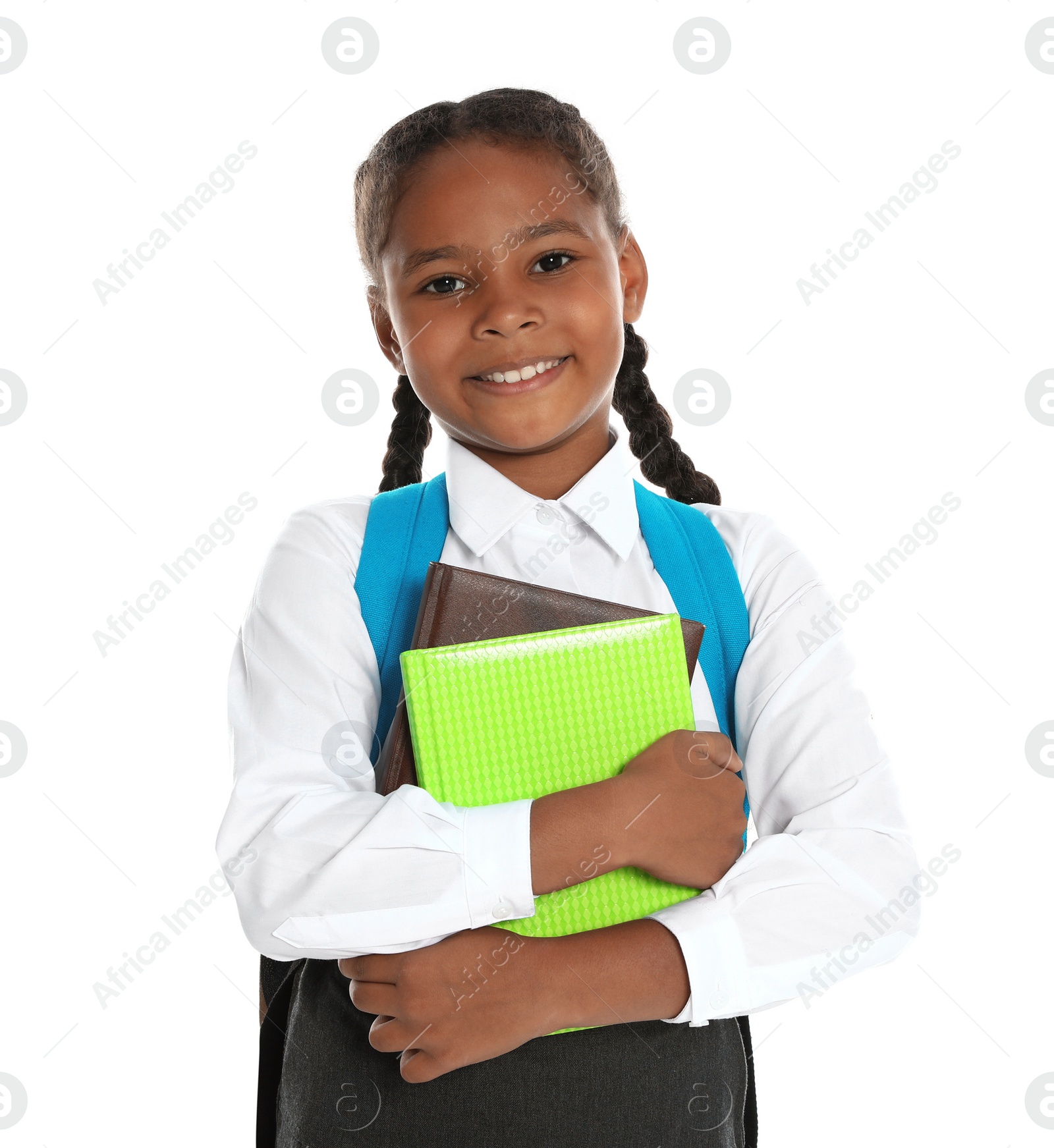 Photo of Happy African-American girl in school uniform on white background