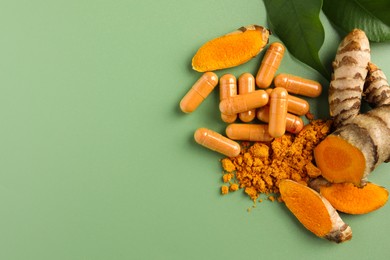 Aromatic turmeric powder, pills and raw roots on green background, flat lay. Space for text