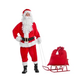 Man in Santa Claus costume with bag and sleigh on white background