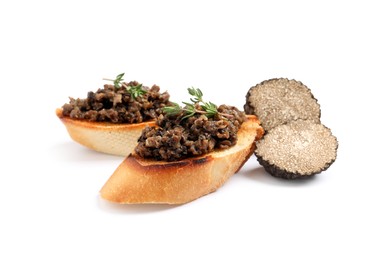 Tasty bruschettas with truffle paste on white background