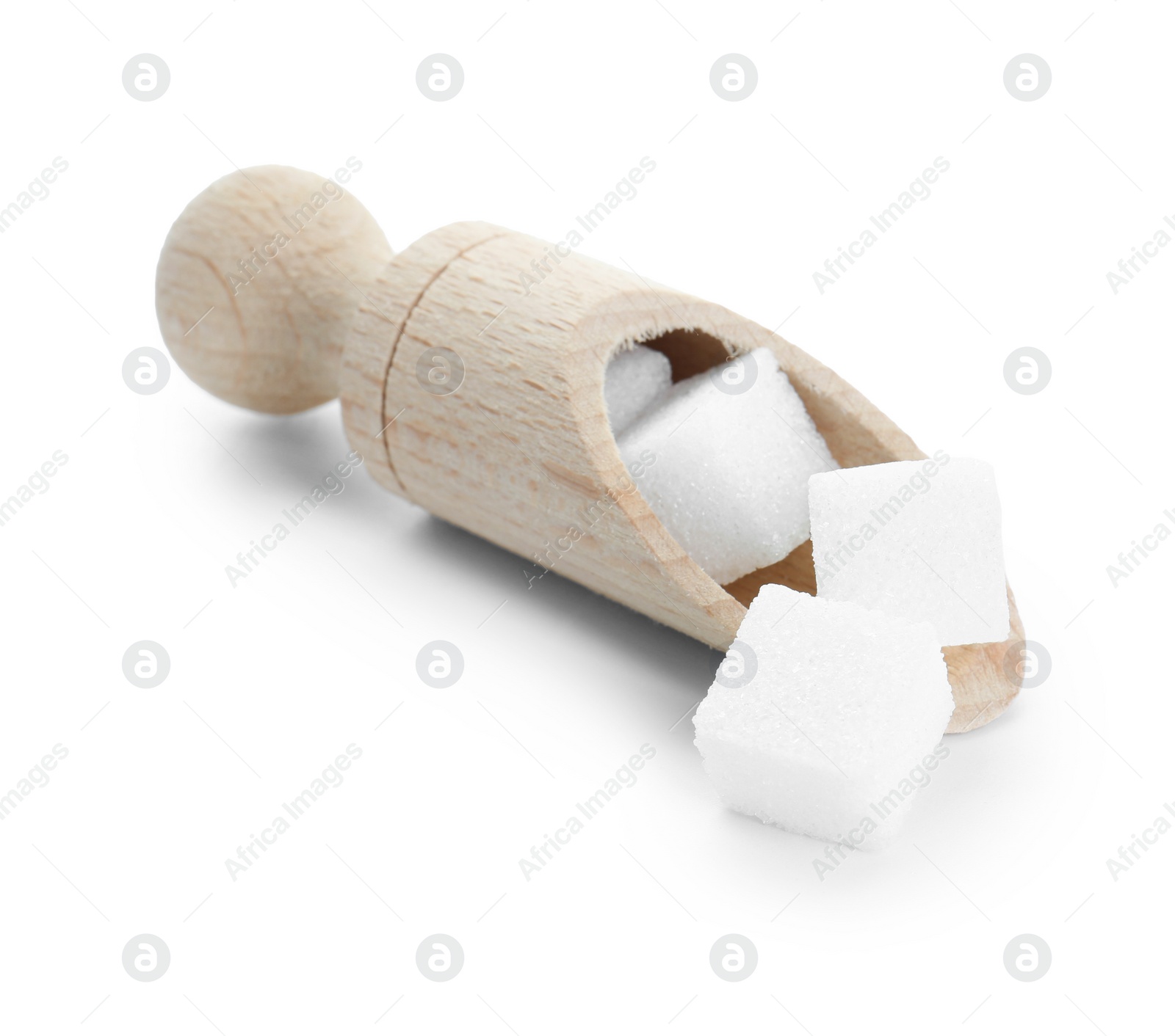 Photo of Sugar cubes in wooden scoop isolated on white